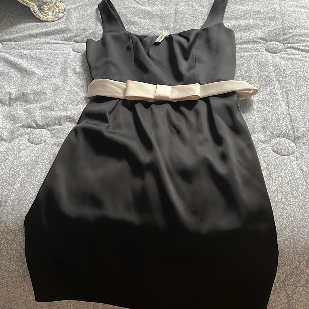 Size 12 Cocktail Dress. New with tags Black with white belt